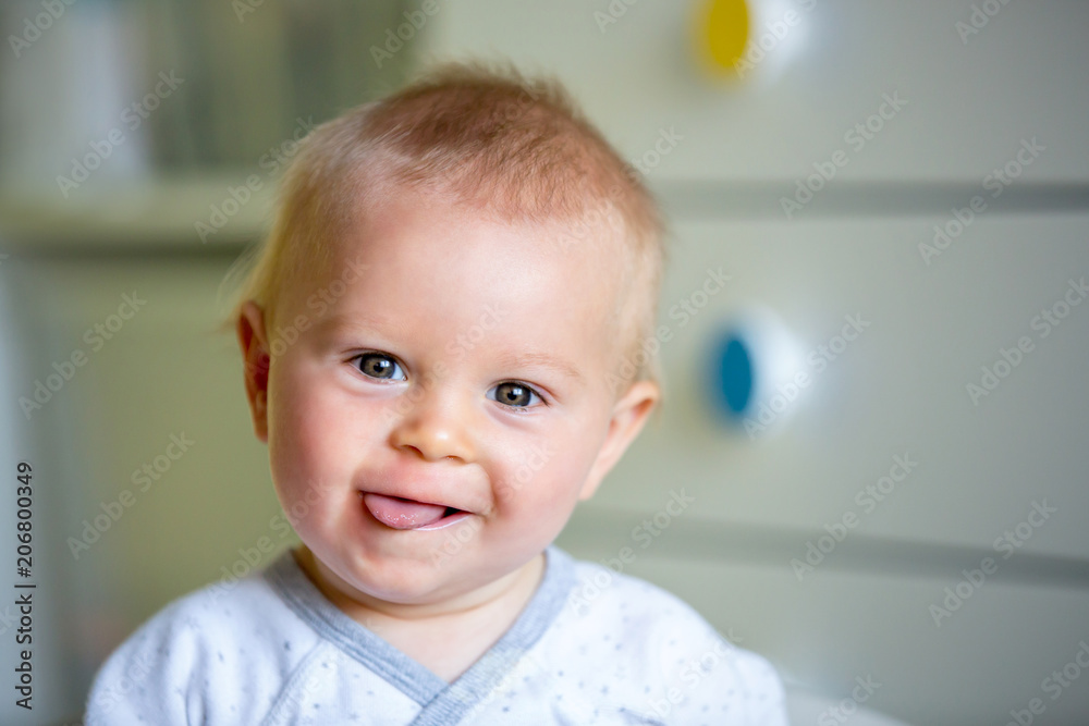 Image of sweet baby boy, closeup portrait of child, cute toddler with blue eyes