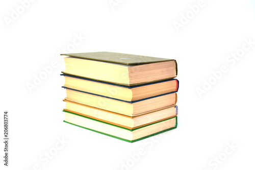 A stack of old books on isolated white background