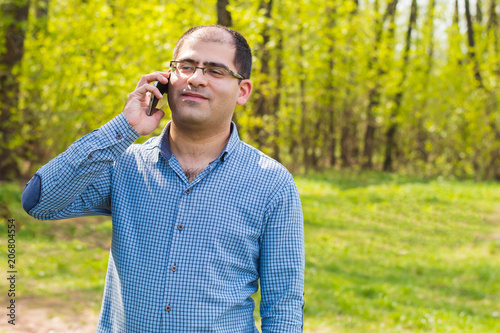 businessman freelancer talking on the phone © Mariia Nazarova