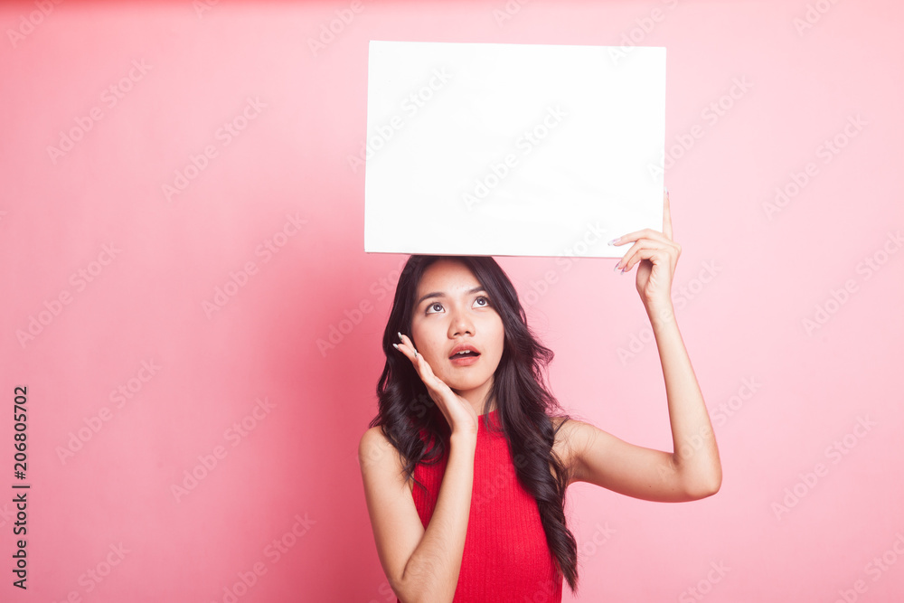 Young Asian woman surprise with white blank sign. Young Asian woman surprise with white blank sign.
