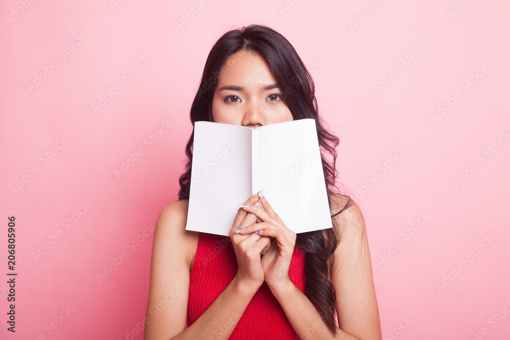 Young Asian woman with a book. Young Asian woman with a book.