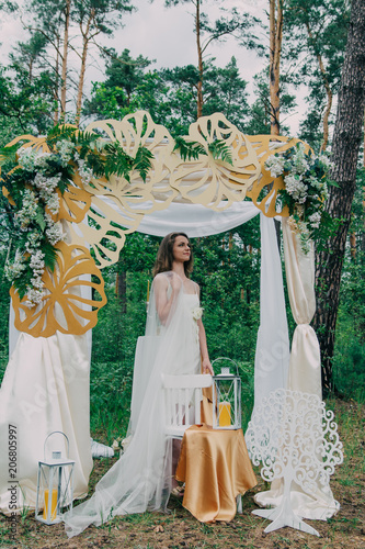 Very beautiful girl photographed in nature with fresh flowers.