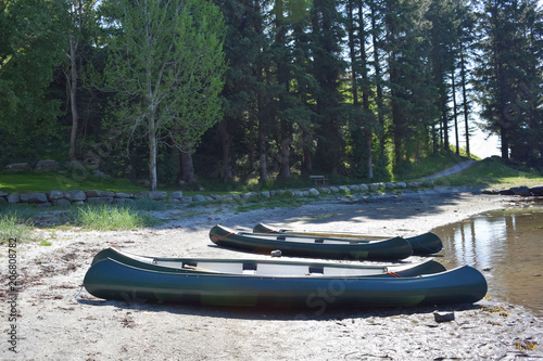 Canoe on the beach on a summer day. Active leisure, tourism. Journey through Scandinavia. Norway. © AntiD