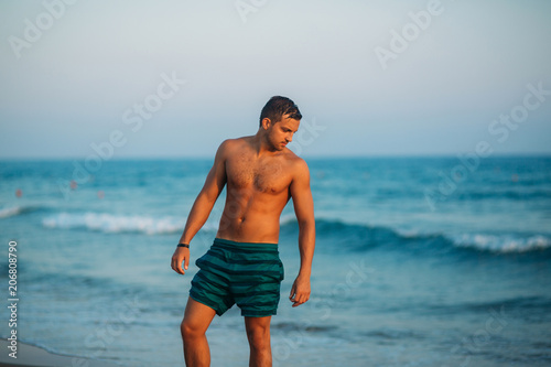 Portrait of an attractive young man on a tropical beach