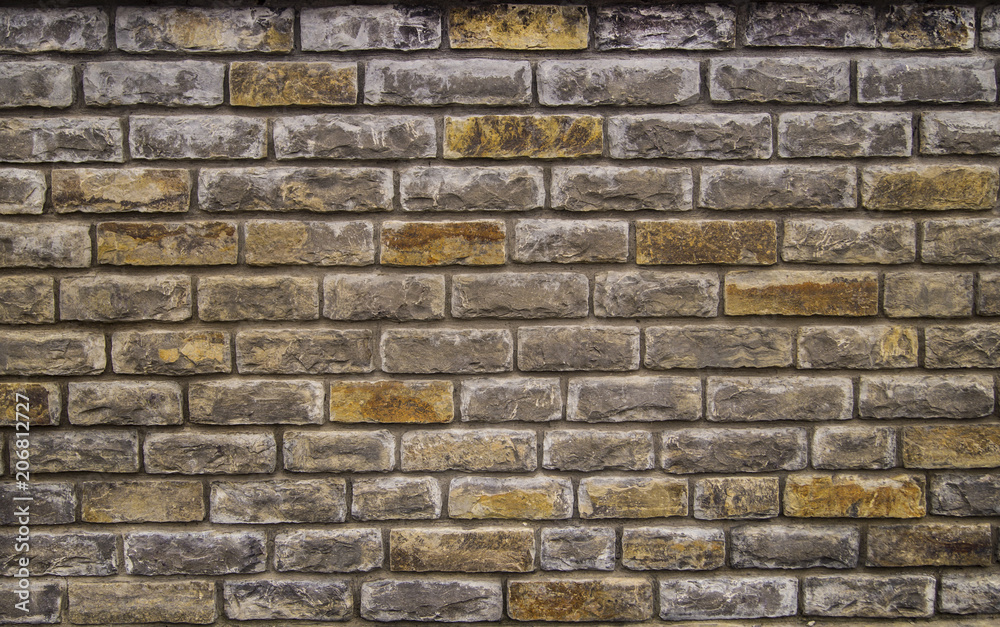 Fototapeta premium beautiful stone masonry of smooth colored stones