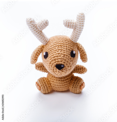 Knitted toy isolated on white background