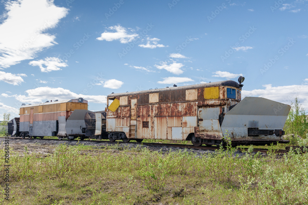 Fototapeta premium old rusty train on a Sunny daytrain technical service,