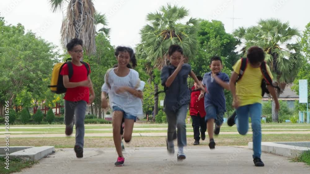 Group of young asian student walking in school park Group of young asian student walking in school park