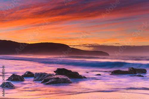 Vibrant Rocky Sunrise Seascape