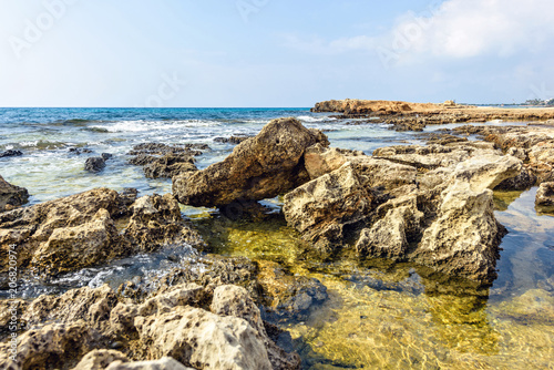 Daylight view to Nissi Beach with colorful bright blue water and sky © frimufilms