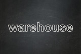 Manufacuring concept: text Warehouse on Black chalkboard background