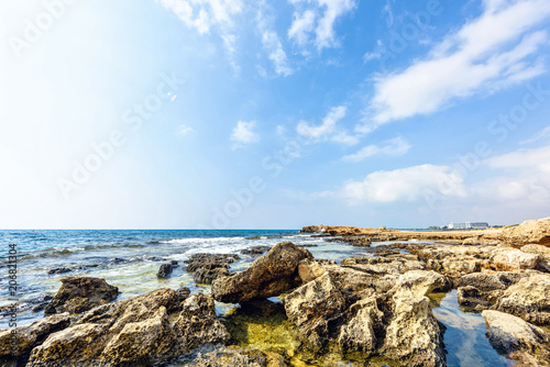 Daylight view to Nissi Beach with colorful bright blue water and sky © frimufilms
