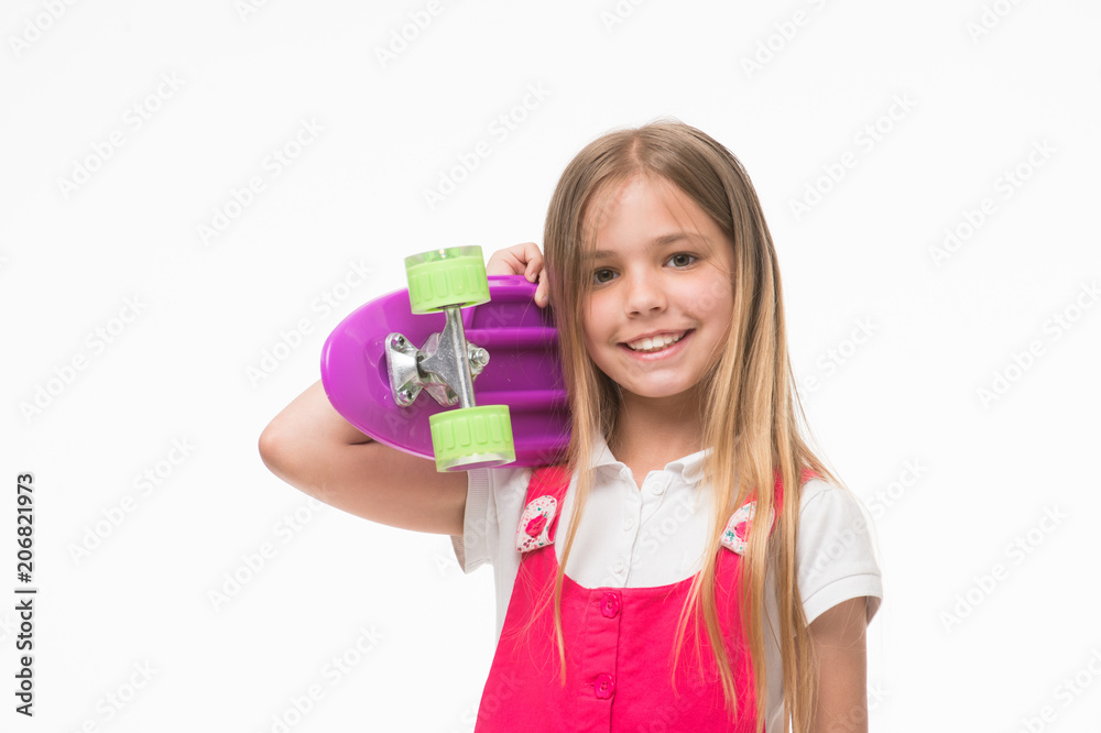 Child skater smiling with longboard. Born to be a skater girl. Small girl smile with skate board isolated on white. Skateboard kid with long hair. Sport activity and energy. Childhood and active game Child skater smiling with longboard. Born to be a skater girl. Small girl smile with skate board isolated on white. Skateboard kid with long hair. Sport activity and energy. Childhood and active game