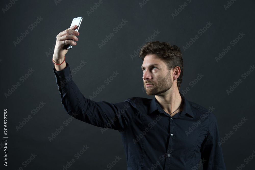 Man make video call with smartphone. Businessman in shirt with mobile phone. Blog and weblog in social network. New technology for modern life and business communication