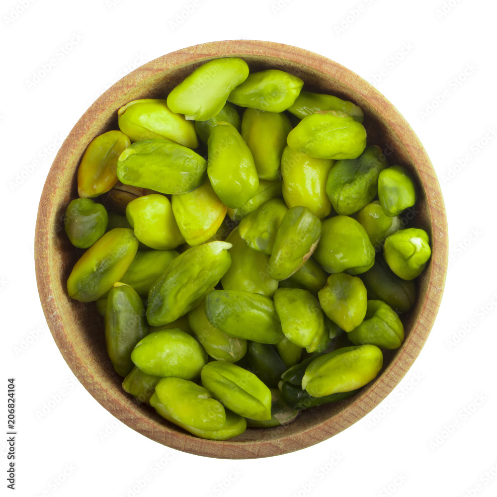 green shelled pistachio in wooden cup isolated on white background. top view green shelled pistachio in wooden cup isolated on white background. top view