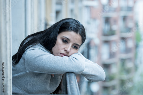 Young beautiful unhappy woman suffering from depression photo