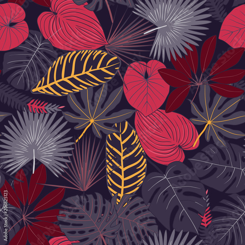 Seamless pattern from tropical leaves. multi-colored tropical leaves pattern