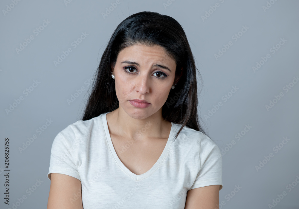 Human expressions, emotions. Young attractive woman with a depressed face, looking sad and unhappy Human expressions, emotions. Young attractive woman with a depressed face, looking sad and unhappy