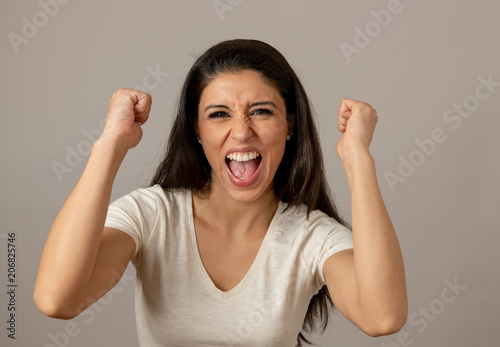 фотографія Happy excited and euphoric attractive young woman celebrating money win and succ