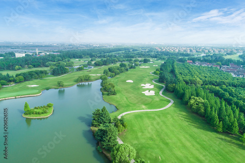 Fototapeta Naklejka Na Ścianę i Meble -  Aerial view of a beautiful green golf course