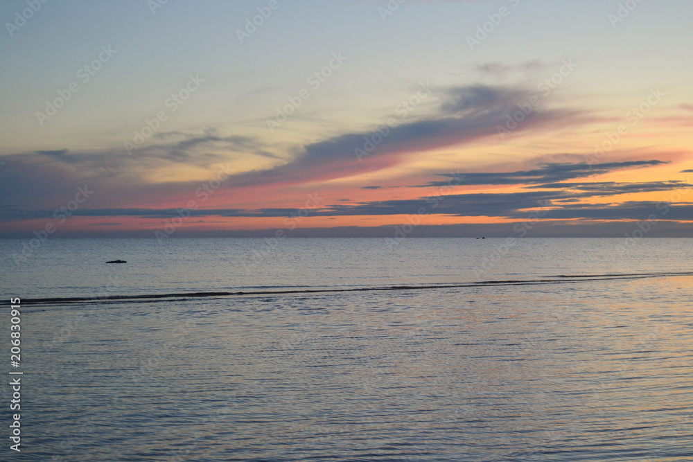 the setting sun on the lake, above the water of the cloud