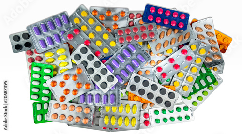 Many of tablet pills isolated on white background. Yellow, purple, black, orange, pink , green tablet pills in blister pack. Painkiller medicine. Drug for migraine headache. Pharmaceutical industry. photo