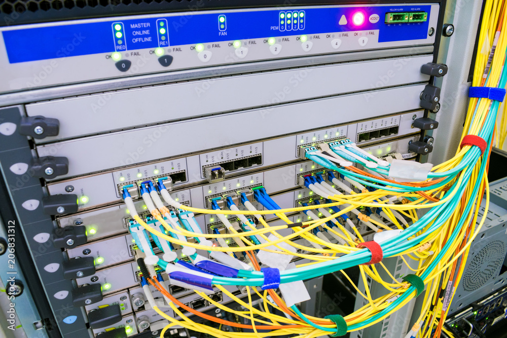 A backbone network router with many optical links is located in the server room of the data center. High-speed internet connection. The main server of the Internet provider. Photos | Adobe Stock