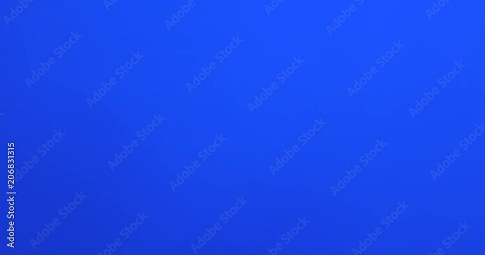 Male fingers grabbing and pulling something invisible toward him on blue screen