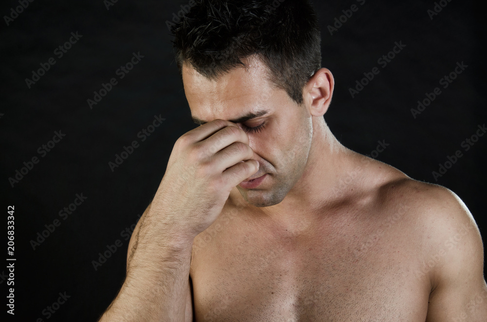 Sexy guy crying. Black background. Sexy guy crying. Black background.