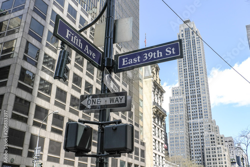 Signs at the corner of 39 East Street and Fifth Avenue in Manhattan New York