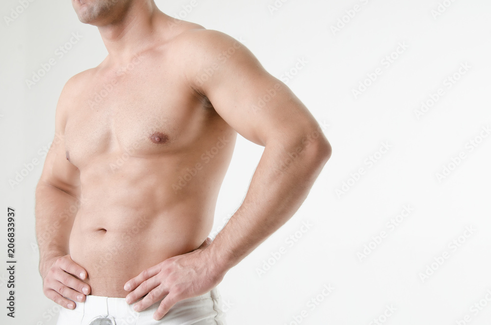 Sexy athletic man. Gray background. Sexy athletic man. Gray background.