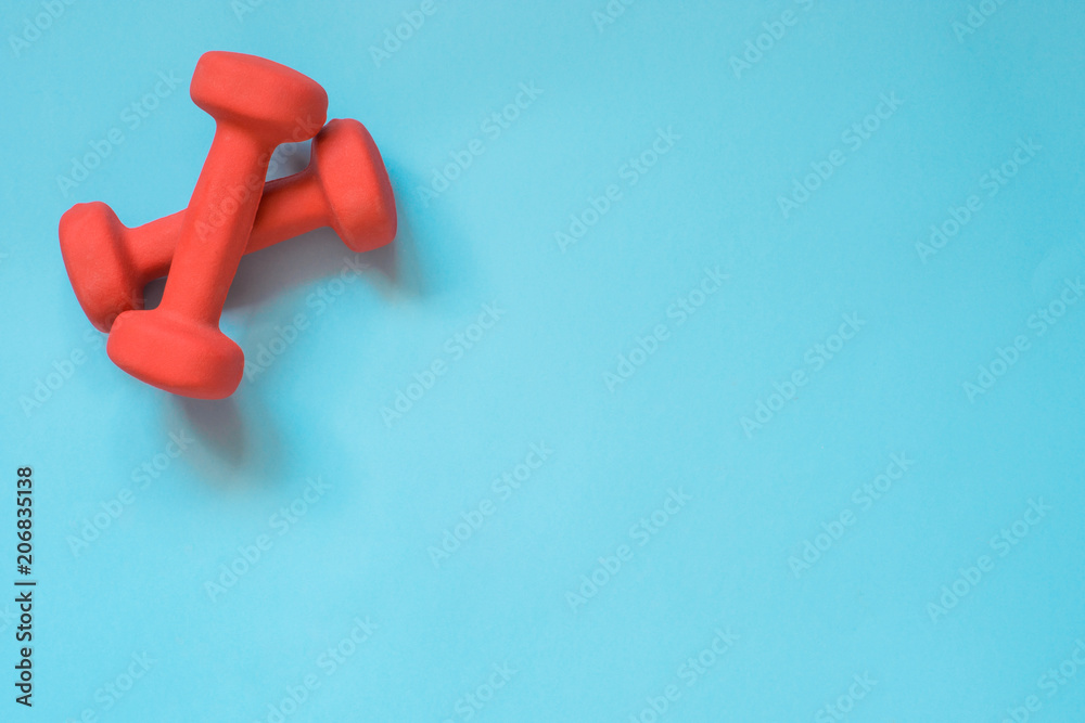Sport and fitness equipment, creative flat lay on punchy blue. Space for you. Sport and fitness equipment, creative flat lay on punchy blue. Space for you.