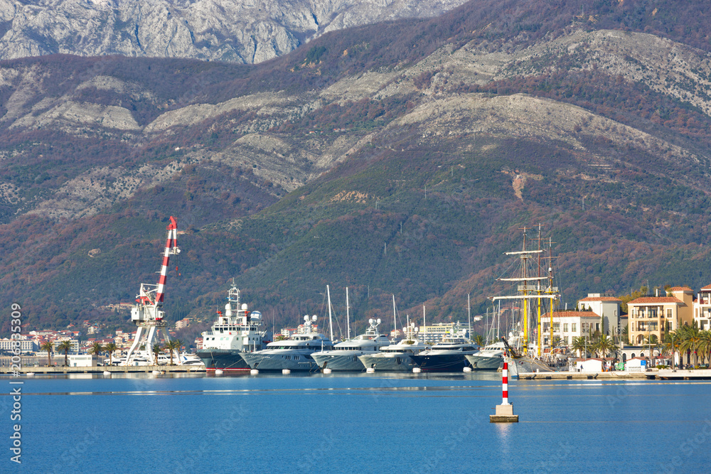 Embankment in Tivat, view of an old sailing ship. Montenegro