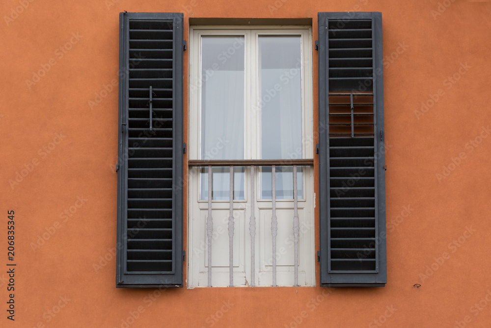 window shutters on orange wall, Burano, Venice