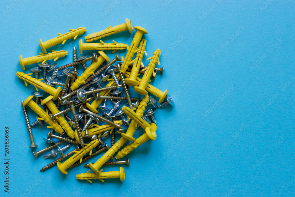 A bunch of different nails on a blue background. Place under the text A bunch of different nails on a blue background. Place under the text