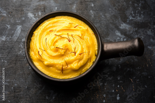 Amrakhand OR Mango Shrikhand / srikhand is popular Indian dessert served with saffron toppings in a bowl photo