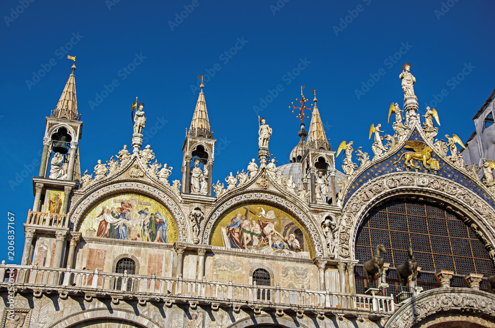Overview of sculptures and frontispiece made in marble and gold on the San Marco Basilica. At the city of Venice, the historic and amazing marine city. Located in Veneto region, northern Italy