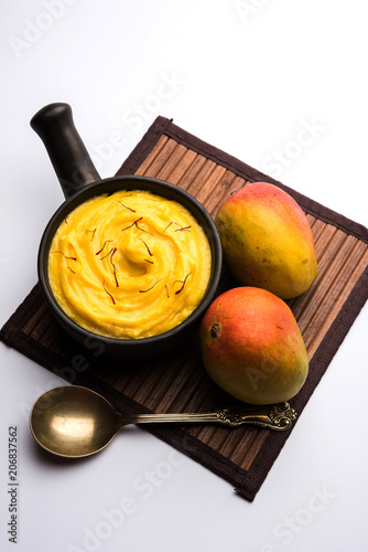 Amrakhand OR Mango Shrikhand / srikhand is popular Indian dessert served with saffron toppings in a bowl photo