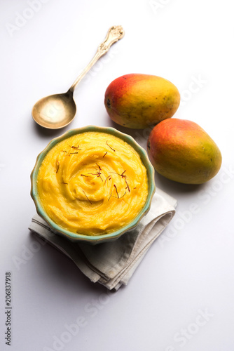 Amrakhand OR Mango Shrikhand / srikhand is popular Indian dessert served with saffron toppings in a bowl photo