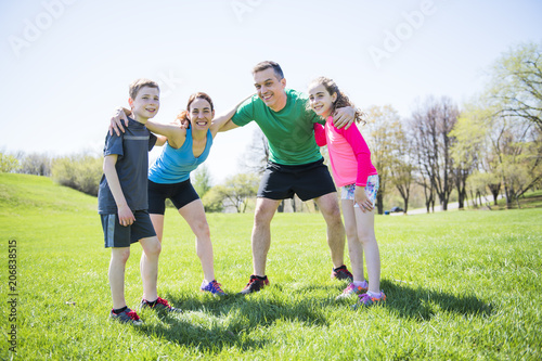 Parents with children sport running together outside