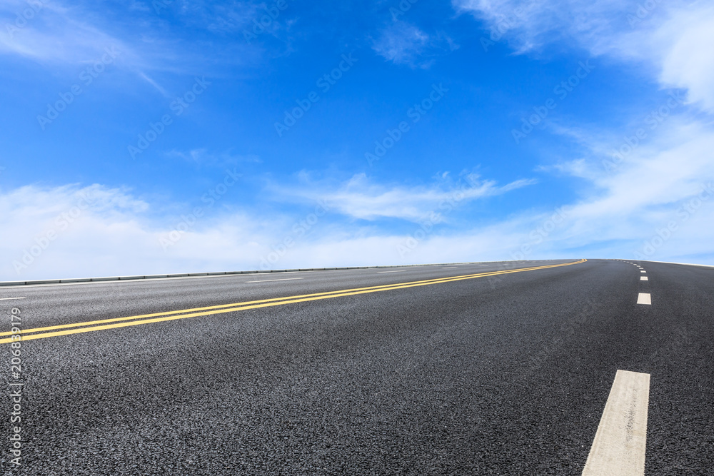 Fototapeta premium new asphalt road and sky clouds