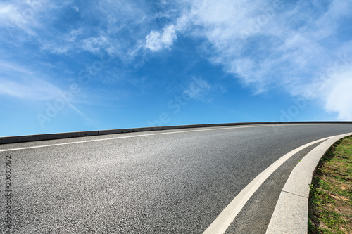 new asphalt road and sky clouds © ABCDstock