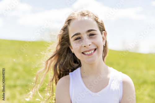 Fototapeta Naklejka Na Ścianę i Meble -  Little happy girl in the field on summer