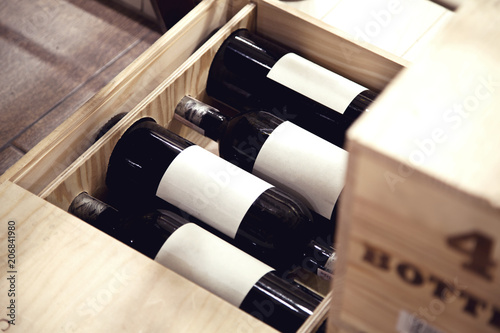  4 bottles of wine in a wooden box