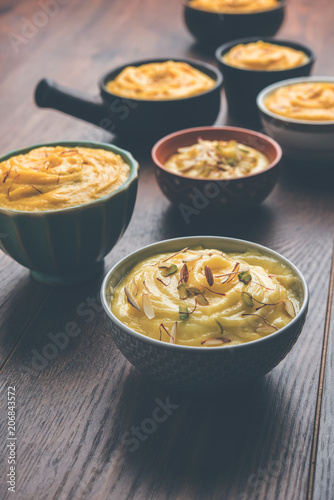 Shrikhand & Amrakhand served in different size bowl in group. Selective focus photo