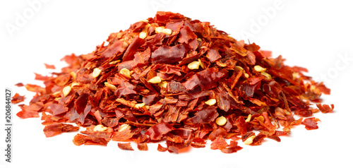dried red pepper flakes isolated on white © Amy Lv