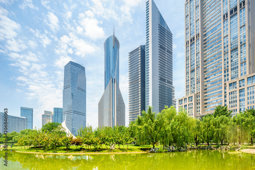 skyscrapers of a modern city with overlooking perspective under blue sky