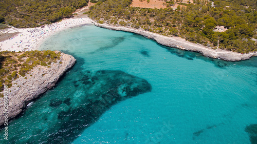 Marvelous aerial drone view of beautiful turquoise sea bay with white sand beach. Mallorca  Spain
