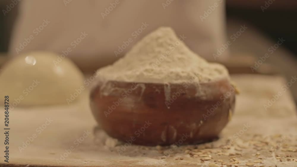 A baker prepares fresh breads and cakes. Two clips. A baker prepares fresh breads and cakes. Two clips.