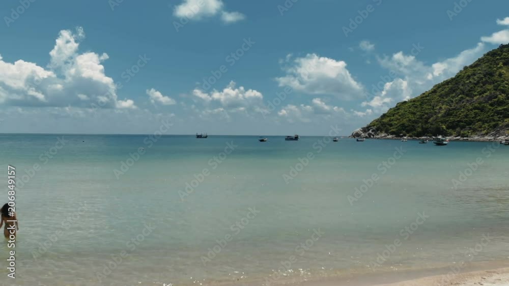flying over amazing white sand beach and tropical lagoon with boats flying over amazing white sand beach and tropical lagoon with boats